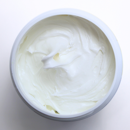 The Frost-It! Decorative Craft Frosting Jar sits open, revealing the adhesive’s smooth, white, frosting-like texture.